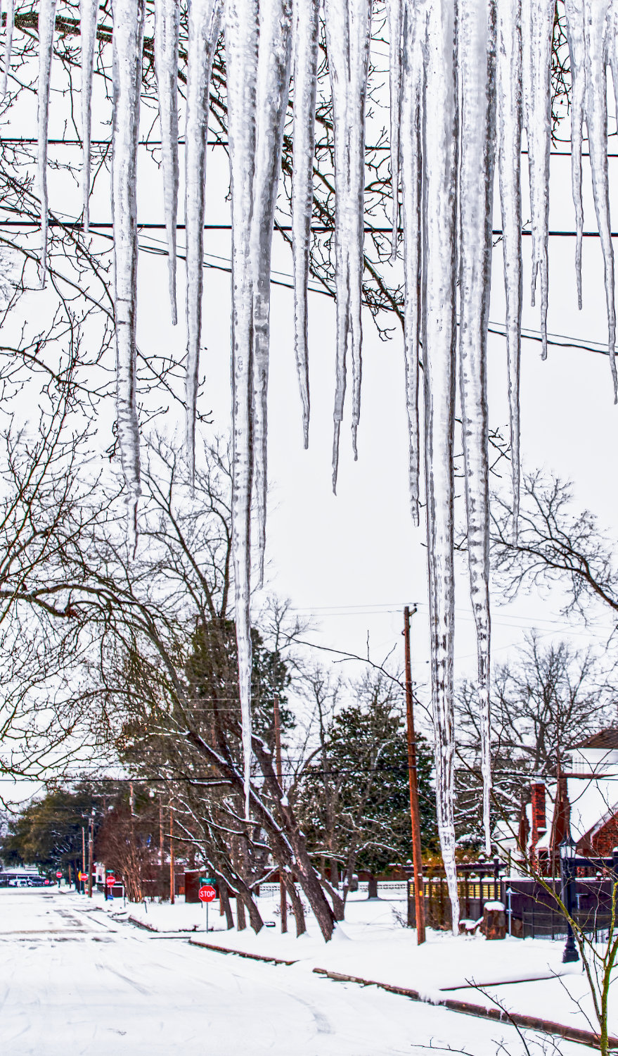 Icicles formed on awnings, roofs, and wires across Wood County and much of Texas, just as these in Mineola had by last Thursday. [get this photo]